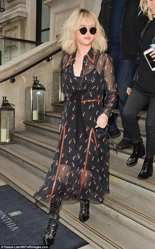 Selena Gomez Dons Semi-Sheer Shirt Dress After Exiting Coach Store on Regent Street, Flaunting a Hint of Leg