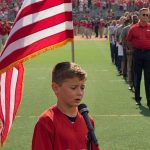 A talented 10-year-old boy sings the national anthem