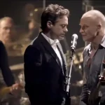 Oscar winner and Ironman actor Robert Downey Jr. sings lead on a Police hit, threatening to steal the show from Sting.