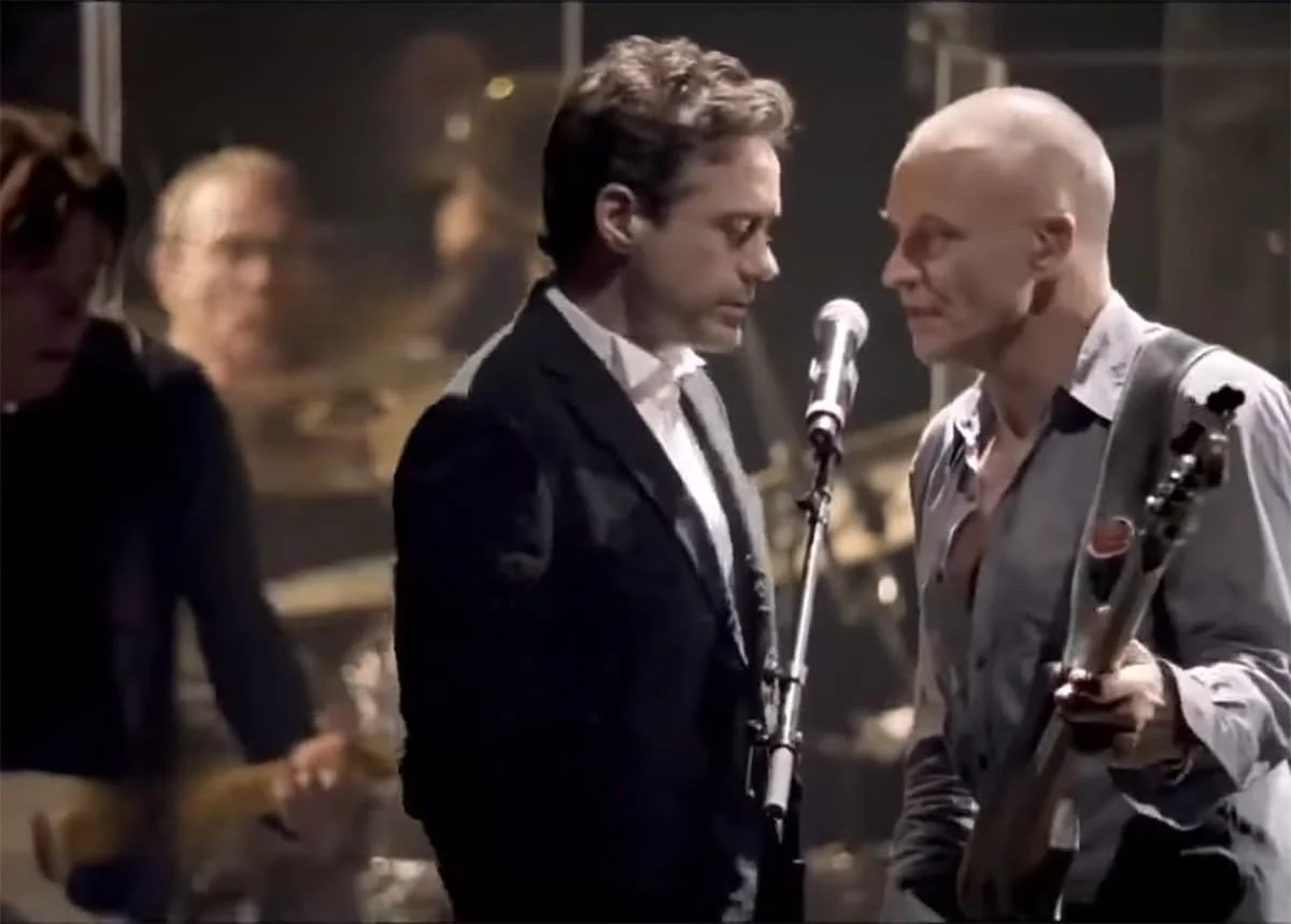 Oscar winner and Ironman actor Robert Downey Jr. sings lead on a Police hit, threatening to steal the show from Sting.